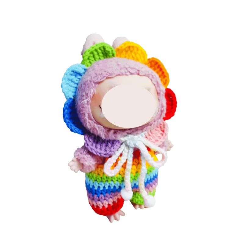 Cute doll wearing a colorful rainbow crochet doll outfit pattern with a flower petal hood