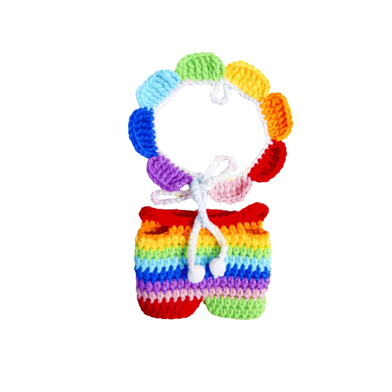 Rainbow crochet doll outfit pattern featuring a colorful handmade top and shorts set with bright rainbow colors