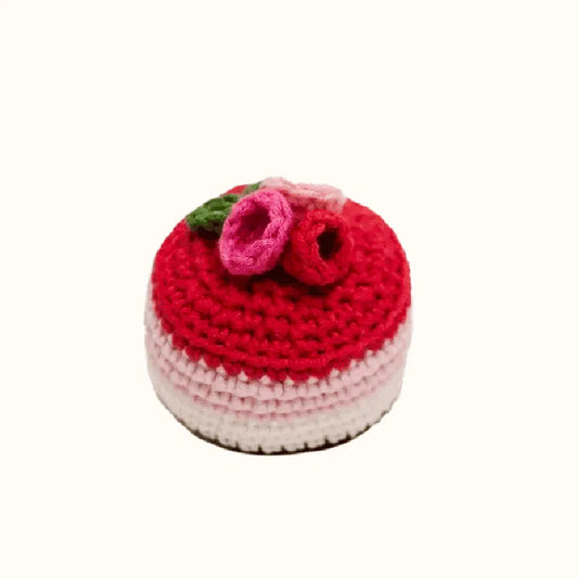 Raspberry mousse crochet tutorial featuring a handmade red and pink crocheted dessert with floral decoration