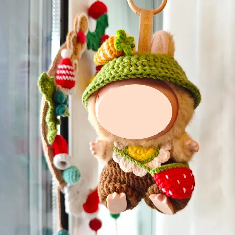 Strawberry carrot doll crochet pattern featuring a handmade doll with green hat and red strawberry bag