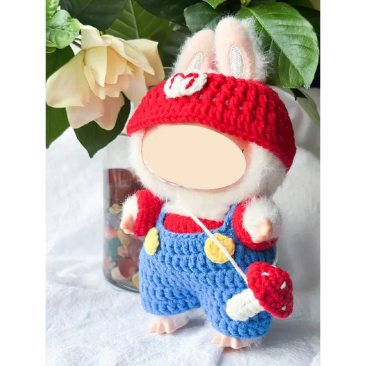 Handmade bunny doll wearing Super Mario crochet pattern outfit with red hat and blue overalls
