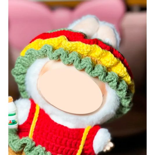 Handcrafted colorful crochet doll with a red dress and green yellow ruffled hat from The Knit Krazy