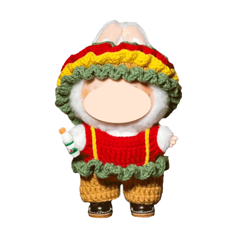 Handmade knitted bunny doll wearing colorful ruffle hat and red sweater holding a small bottle
