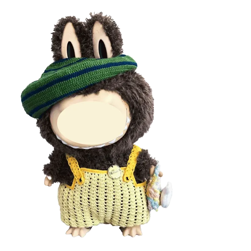Hand holding a black and white crocheted bird hat made with the Zimomo crochet outfit pattern