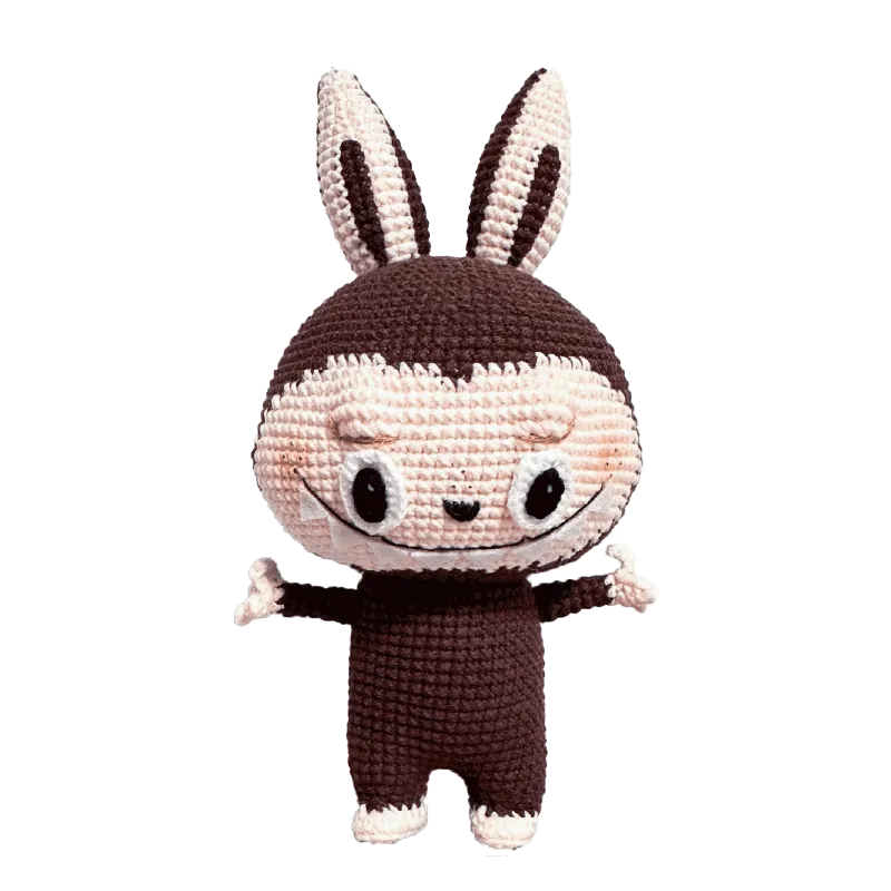 Redbook crochet doll featuring Zimomo inspired crochet pattern with brown and cream yarn details