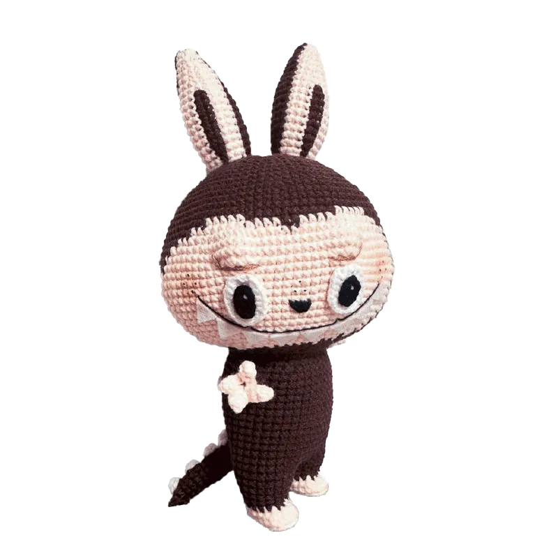 Zimomo inspired crochet pattern featuring a cute crocheted bunny-like character with large ears and expressive eyes