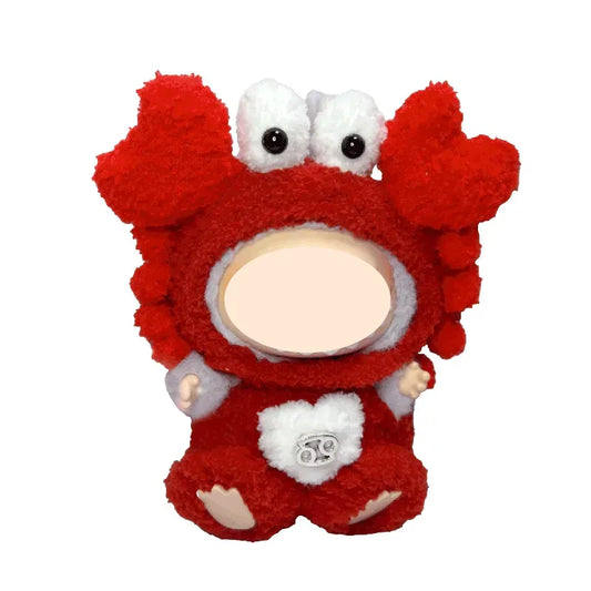Red plush toy with a white face on a white background