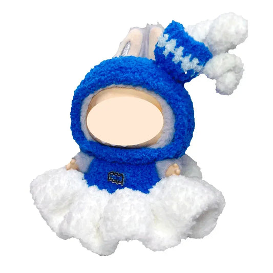 Plush toy of a baby in a blue snowsuit with a white background