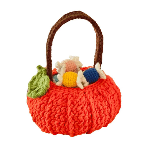 Knitted basket with colorful yarn balls on a white background