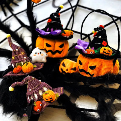 Crocheted Halloween decorations including pumpkins and gnomes on a spider web background.