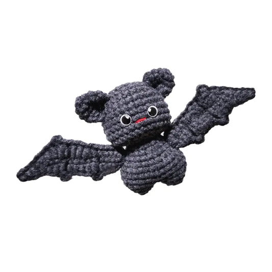 Crocheted bat toy on a white background