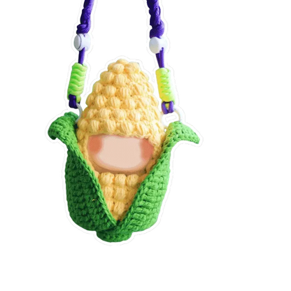 Amigurumi doll crochet kit featuring a handmade crocheted corn cob doll with green husk and yellow kernels
