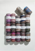 Assorted colorful yarn skeins labeled Big Gift made from artisan wool blend for crochet accessories