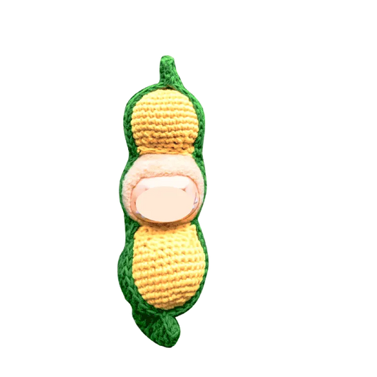 Creative crochet carrier for dolls shaped like a green and yellow peanut pod with soft texture