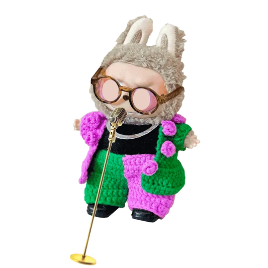 Crochet concert doll outfit pattern featuring a colorful green and pink textured suit with bunny ear hat and sunglasses