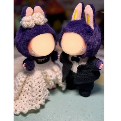 Handmade crochet doll wedding pattern featuring bride and groom dolls with purple bunny ears and detailed outfits