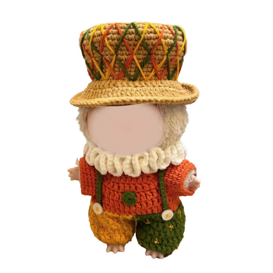 Crochet doll wearing a colorful hat and outfit made with the crochet little duke outfit pattern