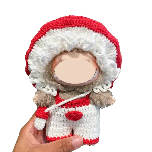Hand holding a handmade crochet mushroom doll wearing red and white outfit Crochet Mushroom Doll Pattern