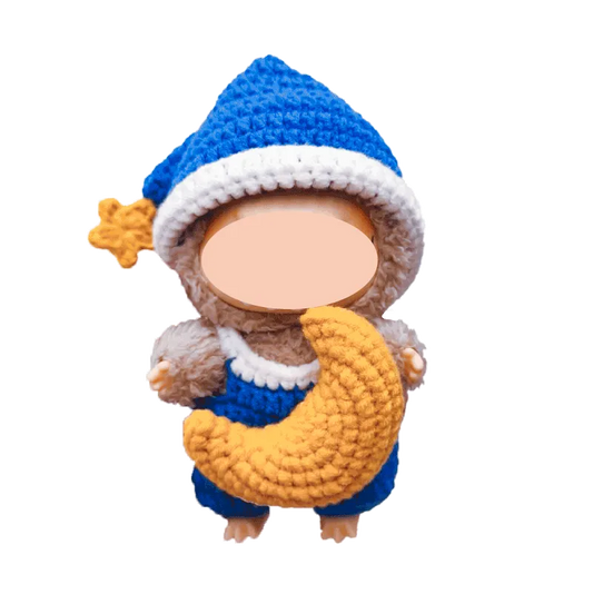 Handmade crochet doll wearing blue and white hat holding a yellow crescent moon plush