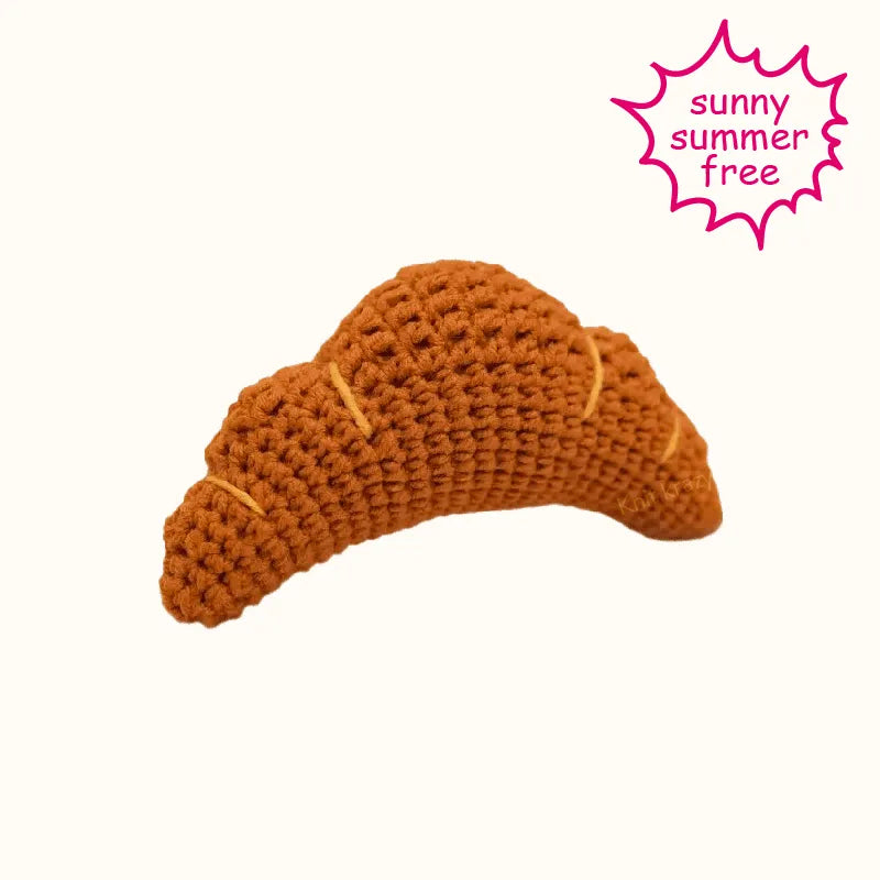 Handcrafted brown crochet croissant made using DIY crochet croissant pattern by The Knit Krazy