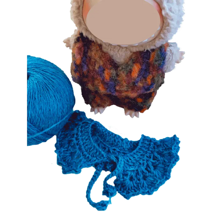 FREE crochet collar and hat pattern for plush dolls showing a blue crocheted collar and a plush doll wearing a knit outfit