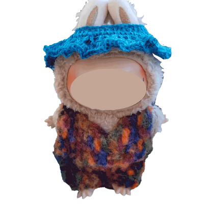 Plush doll wearing a colorful crochet collar and blue hat using FREE｜crochet collar and hat pattern for plush dolls