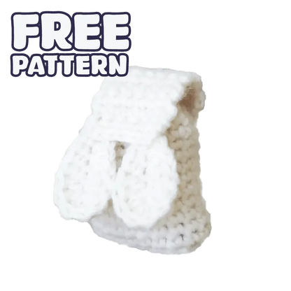 White crocheted miniature backpack with mittens using free doll accessories crochet pattern