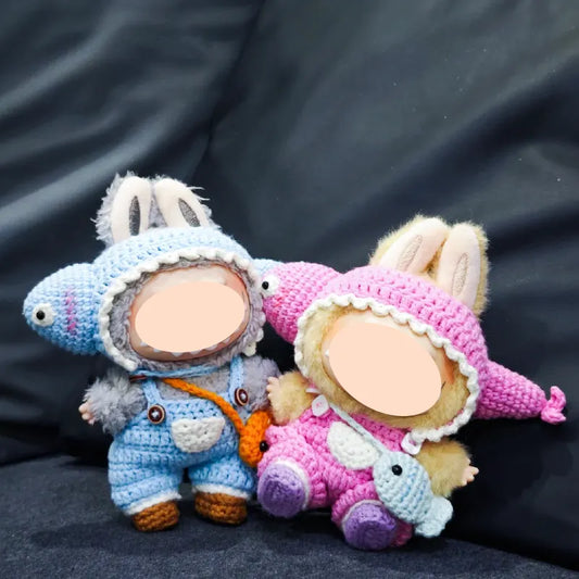 Two dolls dressed in funny fish crochet doll outfit pattern with bunny ears and colorful fish hats