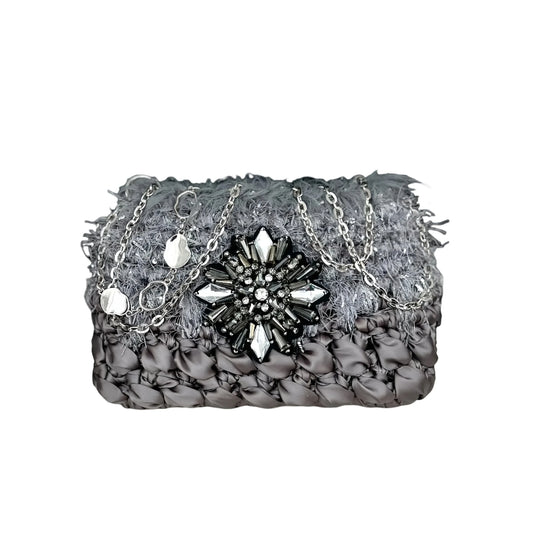 Galactic inspired purse pattern crochet diagram featuring a textured gray purse with jeweled centerpiece and silver chain