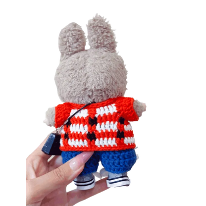 Plush bunny doll wearing GD inspired crochet doll clothes including red and white checkered top and blue pants