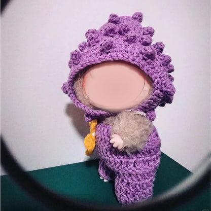 Purple beginner crochet doll outfit on small doll with textured hood designed for beginners