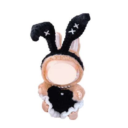 Bunny girl crochet doll outfit pattern featuring black bunny ears and dress on small doll