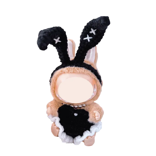 Bunny girl crochet doll outfit pattern featuring black bunny ears and dress on small doll