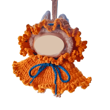 Handmade orange crochet DIY Halloween doll costume with blue tie and ruffled edges