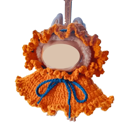 Handmade orange crochet DIY Halloween doll costume with blue tie and ruffled edges