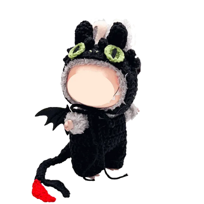 Handmade amigurumi doll wearing night dragon crochet pattern costume with wings and tail