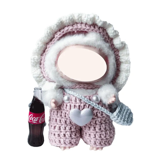 Cute pink knit doll outfit with white fur trim and heart detail on small doll holding a Coca-Cola bottle