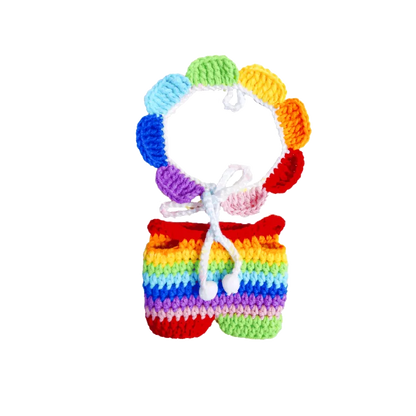 Rainbow crochet doll outfit pattern featuring a colorful handmade top and shorts set with bright rainbow colors