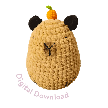 Round capybara crochet soft toy pattern in tan with black ears and orange pumpkin on top digital download