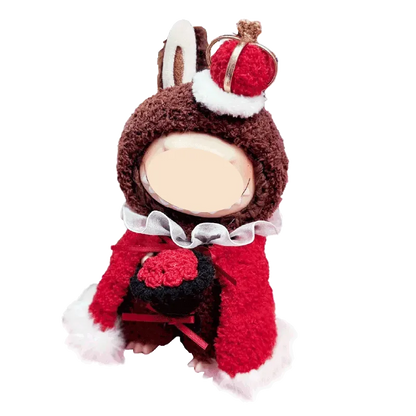 Cute doll wearing a royal king crochet pattern costume with a red cape and crown hat