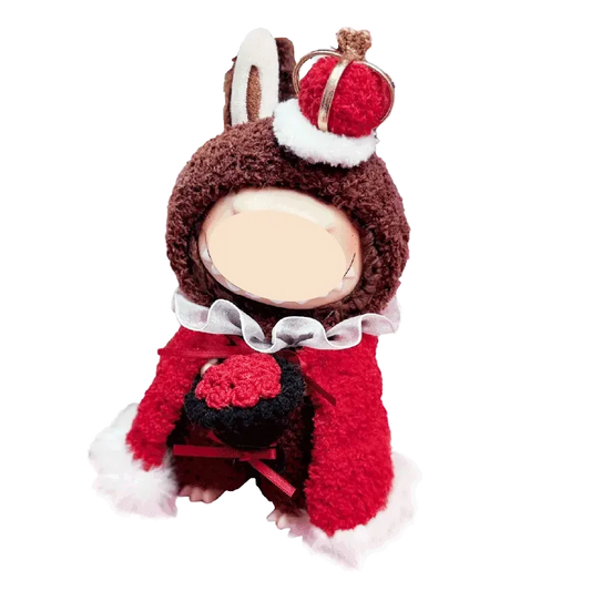 Cute doll wearing a royal king crochet pattern costume with a red cape and crown hat