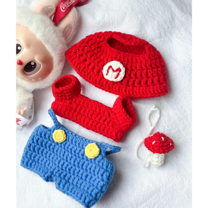 Redbook Super Mario crochet pattern with red hat, blue overalls, and mushroom keychain crocheted accessories