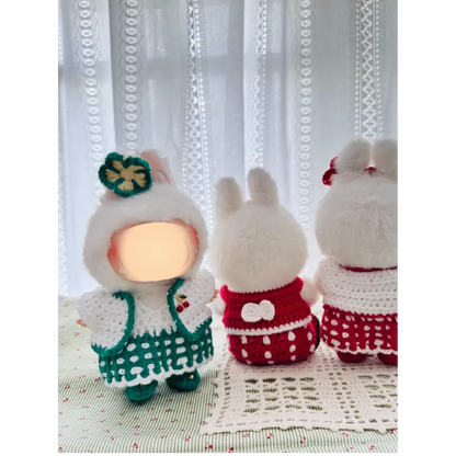 Sweetheart doll outfit pattern featuring handmade crocheted dresses in green and red on plush dolls