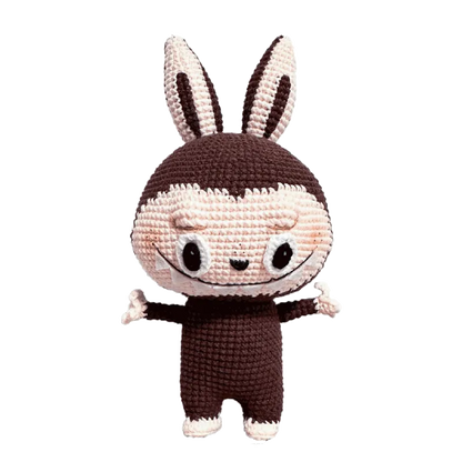 Redbook crochet doll featuring Zimomo inspired crochet pattern with brown and cream yarn details